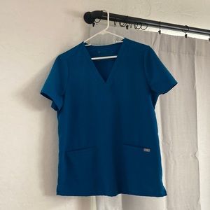 Figs Casma three pocket scrub top in Alps blue.